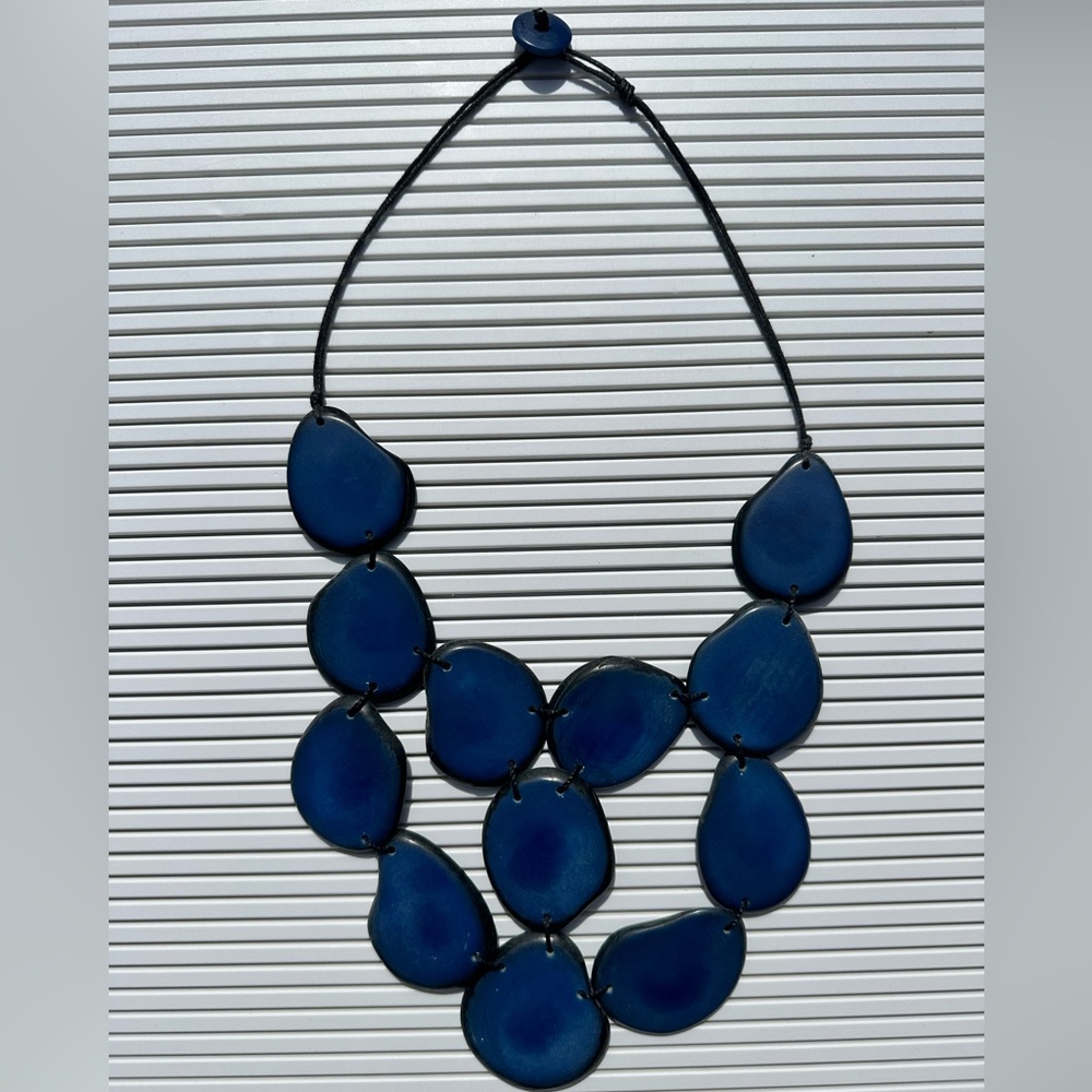 Blue stone necklace on black sting, button closure